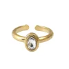 Anillo solitario de acero dorado con circonita