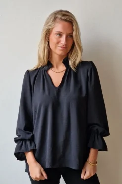 Blusa crepe negra volantes