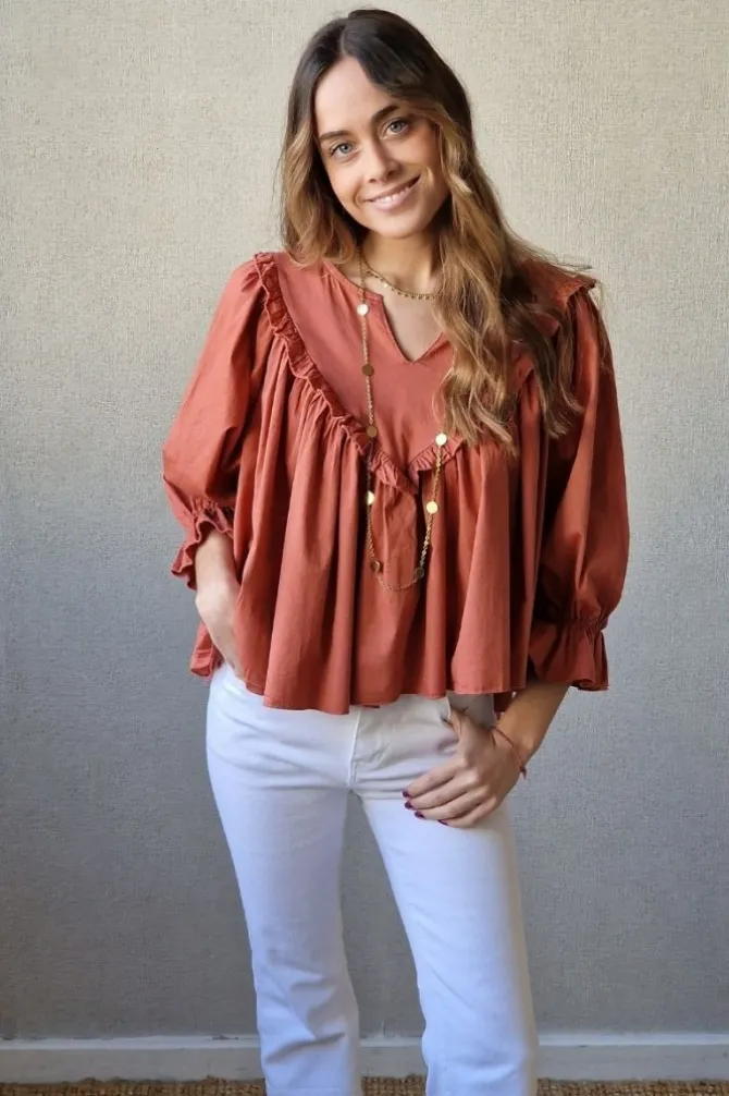 Blusa cuello pico con vuelo caldero