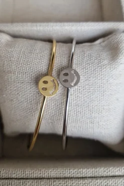 Brazalete de acero rígido fino carita feliz