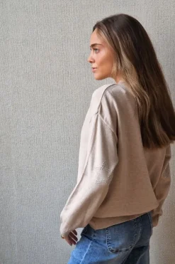 Jersey de mujer con codera de estrellas beige