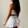 Minifalda pantalón blanca con lurex cintura de goma y volantes