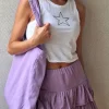 Minifalda pantalón lila con cintura de goma y volantes
