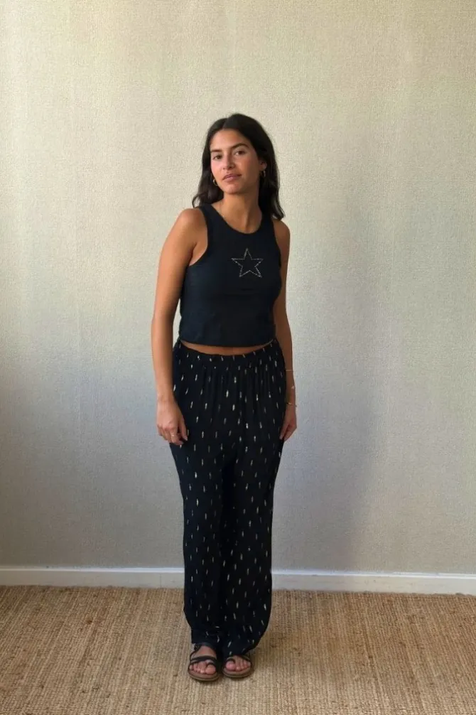Pantalón tipo bambula negro y lurex dorado