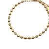 Pulsera finita de acero dorada con bolitas