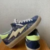 Sneakers azul con detalles glitter con rayo