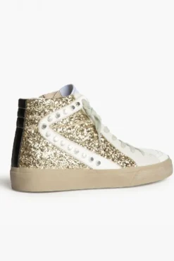 Sneakers doradas con detalles de tachuelas y glitter