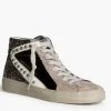 Sneakers negras con detalle blanco, glitter y tachuelas
