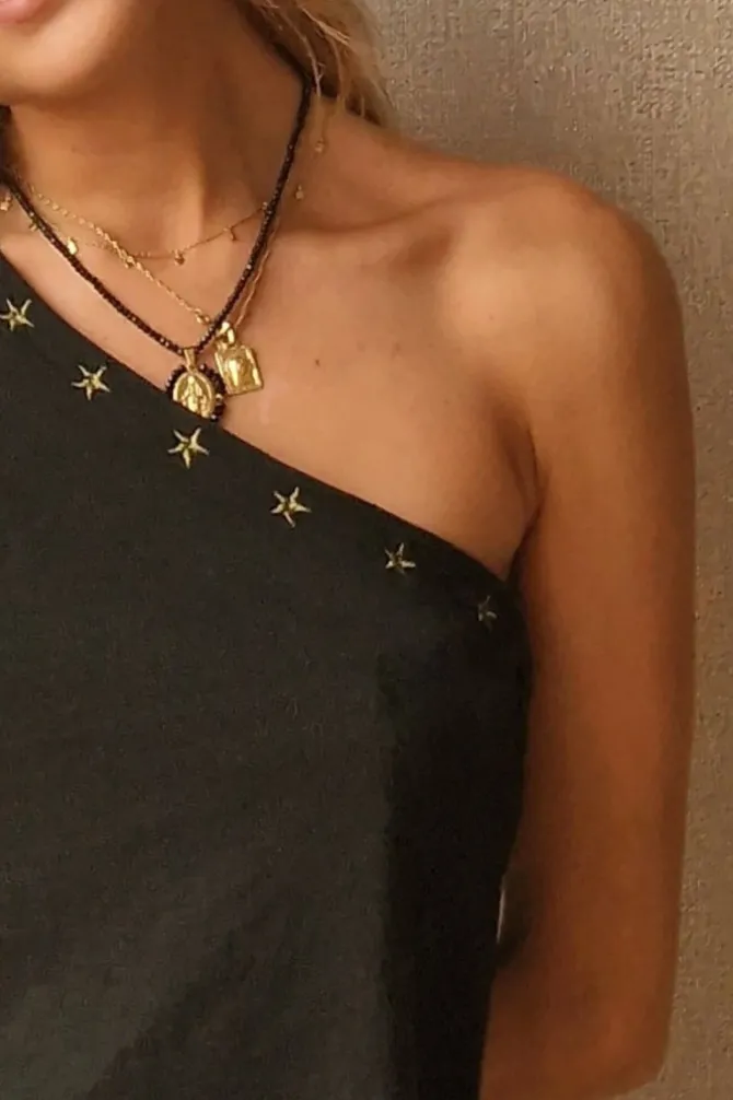 Top asimétrico con estrellas negro